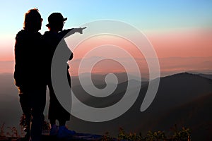 Couple enjoys sunrise over Blue Ridge mountains in NC