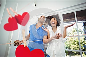 Couple entering home decorated with hearts