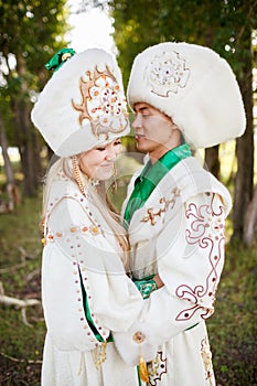 Couple in ethnic clothes outdoors.