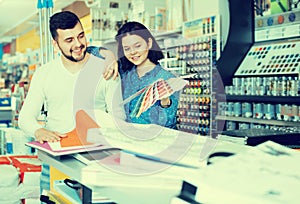 Couple examining various decorative materials