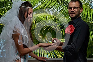 Couple Exchanging seashell Wedding Ring