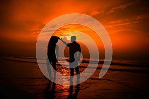 Couple exercising on the beach