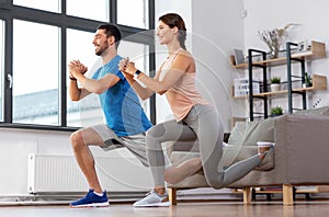 Couple exercising and doing lunge at home