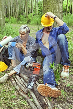 Couple of expert woodsmen taking a break