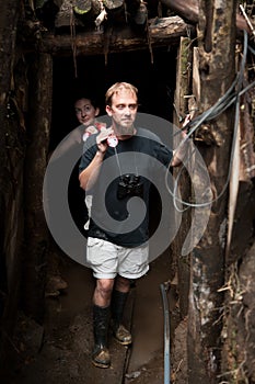 Couple exploring abandoned gold mine in Costa Rica