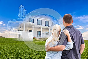 Couple Facing Ghosted House Drawing and Photo Over Green Landscape