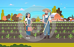 Couple farmers planting seedlings plants vegetables man woman gardeners using shovel and watering can agricultural