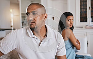 Couple, fight and frustrated on living room couch for worry, mistake or angry with anxiety in house. Man, woman or