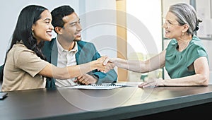 Couple, financial advisor and handshake with documents for meeting, insurance and people for agreement. Contract, broker