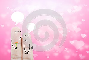 Couple finger holding flower and chat box on bokeh pink heart