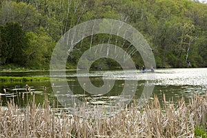 Couple fishing in a peaceful spring lake