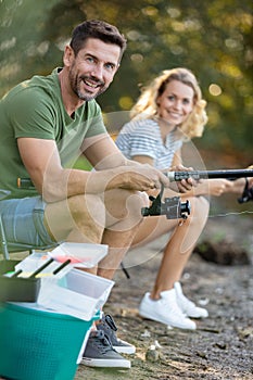 Couple fishing on pontoon