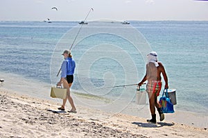 Couple fishing by sea