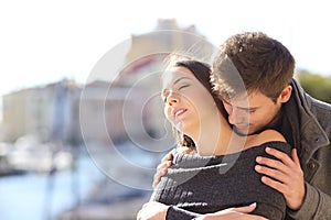 Couple flirting with passion in the street