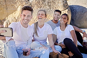 Couple of friends, selfie and drinks on a beach picnic with a smile for a social media update while on vacation in