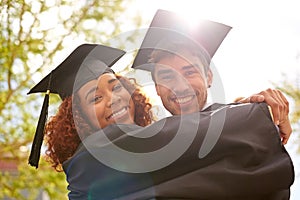 Couple of friends, university and smile for graduation on campus with celebration, success and completion for