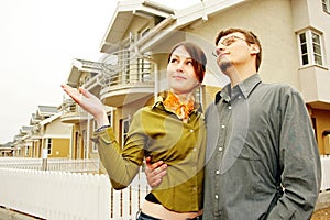 Couple in front of family house