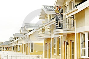 Couple in front of family house