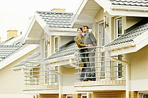 Couple in front of family house