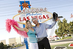 Couple In front Of 'Las Vegas' Sign
