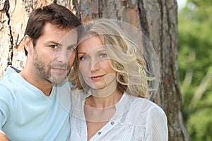 Couple in front of tree