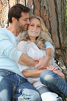 Couple in front of tree