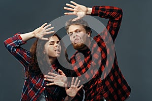 Couple funny faces crushed on transparent glass