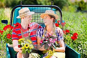 Couple in garden with flowers on gape photo