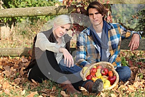 Couple gathering apples