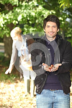 Couple gathering chestnuts