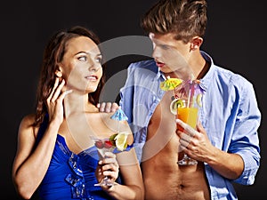 Couple with glass of cocktail.