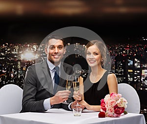 Couple with glasses of champagne at restaurant