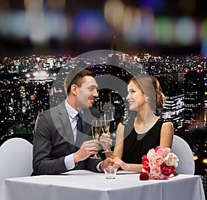 Couple with glasses of champagne at restaurant