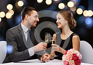 Couple with glasses of champagne at restaurant