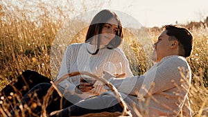 Couple With Glasses Of Red Wine at sunset light