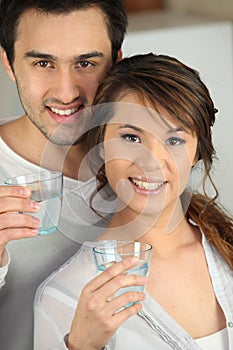 Couple with glasses of water