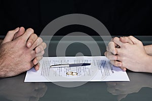 Couple goes through divorce signing papers
