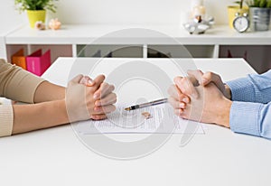 Couple going through divorce signing papers