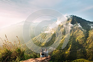 The couple greets the sunrise in the mountains