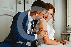 Couple groom and bride against the background studio