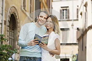 Couple With Guidebook In Rome