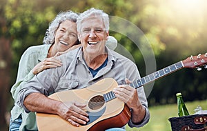 Couple, guitar and picnic with a senior man and woman in nature with a smile and music for fun. Happy, retirement and