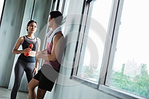 Couple at the gym chating in the break time