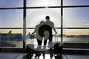 Couple waiting for flight in airport