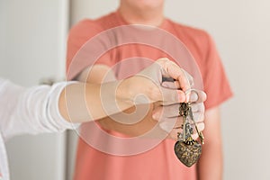 couple hands holding key of new house