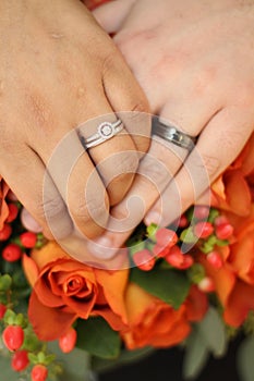Couple Hands Wedding on Bouquet