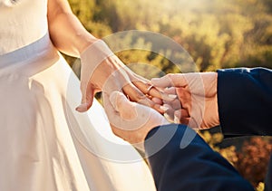 Couple hands, wedding ring and love ceremony outdoor with jewelry and save the date announcement. Engagement, together