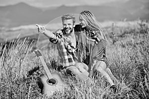 Couple happy cuddling nature background. Romantic hike. Family hike. Boyfriend and girlfriend with guitar in mountains