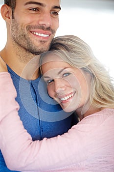 Couple, happy and embrace in portrait for love, relationship or memories together. Man, woman and romantic hug smile for