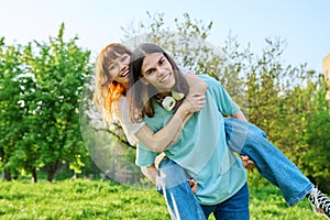 Couple of happy having fun teenagers together outdoor